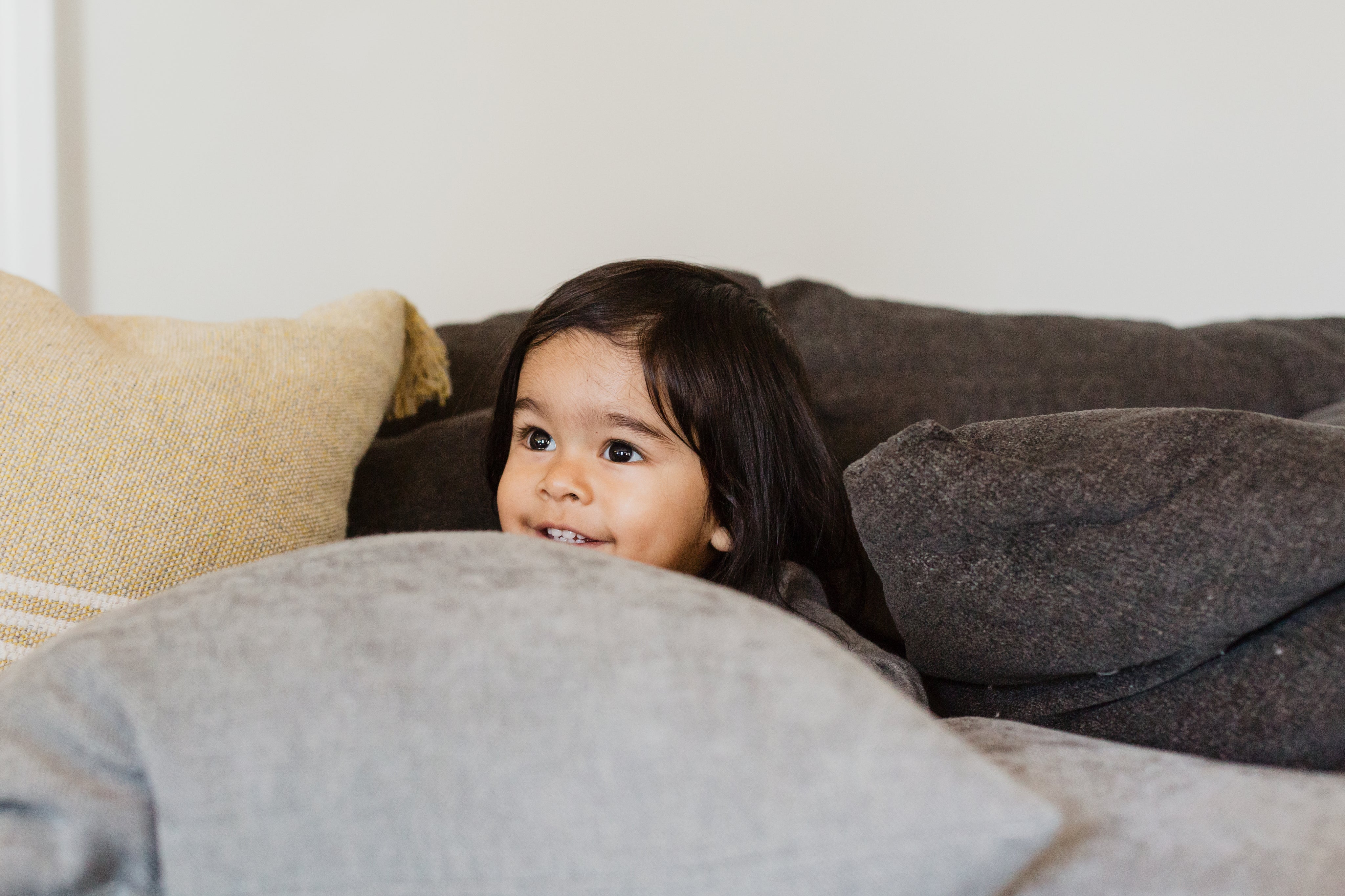 child-peeks-through-pillows.jpg
